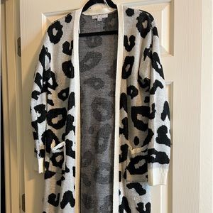 Cheetah print sweater .